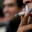 A man smokes marijuana during a demonstration in front of the Mexican Senate building in Mexico City on September 28, 2016