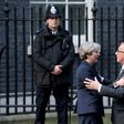 European Commission President Jean-Claude Juncker (R) is greeted by British Prime Minister Theresa May outside 10 Downing Street in London