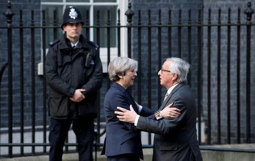 European Commission President Jean-Claude Juncker (R) is greeted by British Prime Minister Theresa May outside 10 Downing Street in London