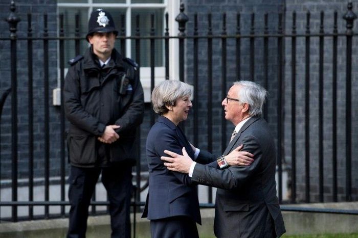 European Commission President Jean-Claude Juncker (R) is greeted by British Prime Minister Theresa May outside 10 Downing Street in London
