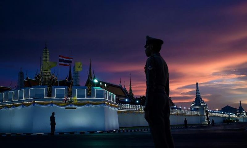 Police stand guard near the Grand Palace in Bangkok ahead of the coronation of Thailand's King Maha Vajiralongkorn