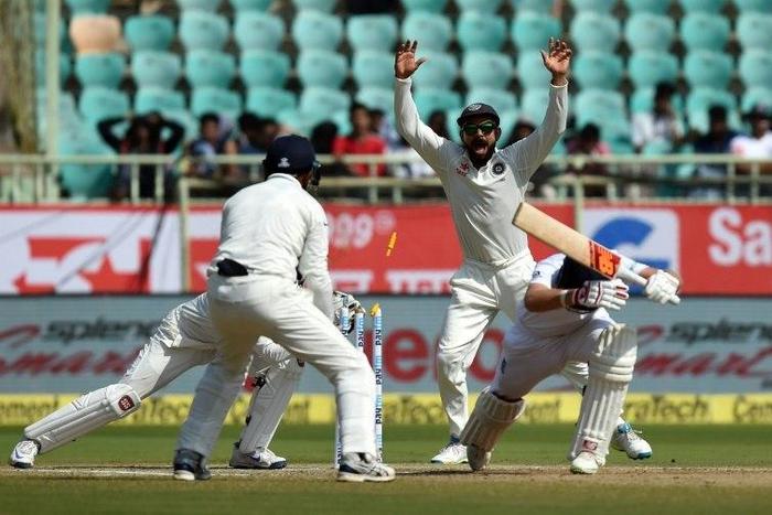 India's Virat Kohli (C) appeals unsuccessfully for a stumping against England's Joe Root (2R) during the last day of the second Test at the Dr. Y.S. Rajasekhara Reddy ACA-VDCA Cricket Stadium in Vishakhapatnam on November 21, 2016