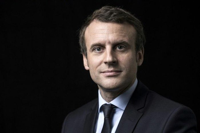 French presidential election candidate for the En Marche movement Emmanuel Macron poses for a photo session on March 7, 2017 at his campaign headquarters in Paris