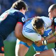 Italy's fly-half Edoardo Padovani (C) fights for the ball with France's center Gael Fickou (R) during their Six Nations rugby union match, at the Olympic Stadium in Rome, on March 11, 2017