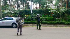 A security officer prepares to detonate some of the explosives left behind by Al Shabaab terrorists at Dusit Hotel