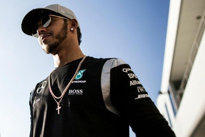 Mercedes driver Lewis Hamilton of Britain looks on after talking to the media during the Formula One Japanese Grand Prix in Suzuka on October 6, 2016