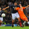Scotlands's Paul Hartley (L) vies with Wesley Sneijder of The Netherlands during the FIFA 2010 World Cup qualifier at Hampden Park in Glasgow, Scotland, on September 9, 2009