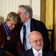 US actor Robert De Niro (R) hugs actress and comedian Ellen DeGeneres after she was presented with the Presidential Medal of Freedom, at the White House