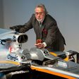 Sahara Force India team principal Vijay Mallya takes a picture of the VJM10 car at a launch event at the Silverstone motor racing circuit near Towcester, central England on February 22, 2017