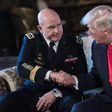 US President Donald Trump shakes hands with H.R. McMaster (L) as his national security adviser at his Mar-a-Lago resort in Palm Beach, Florida, on February 20, 2017