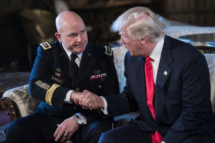 US President Donald Trump shakes hands with H.R. McMaster (L) as his national security adviser at his Mar-a-Lago resort in Palm Beach, Florida, on February 20, 2017