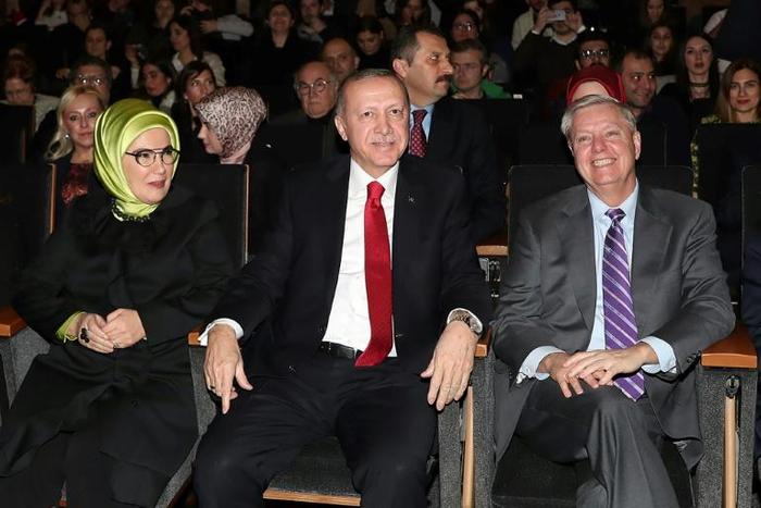 Turkish President Recep Tayyip Erdogan attended Say's "Troy Sonata" concert in Ankara along with wife Emine Erdogan and US Senator Lindsey Graham in this presidential office handout picture