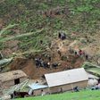 A handout picture taken on April 29, 2017 and provided by the Kyrgyz Red Crescent Society press service shows rescue workers and soldiers working at the site of a landslide in the village of Ayu in Kyrgyzstan's Osh region