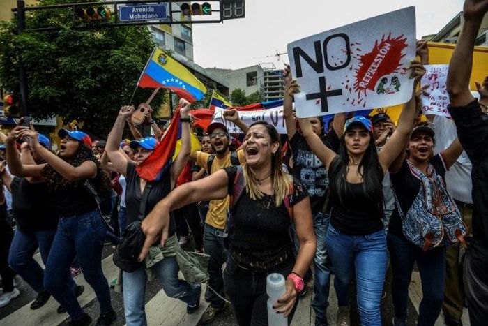 Venezuelan opposition activists protest in Caracas, on May 7, 2017