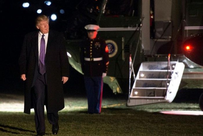 US President Donald Trump walks away from Marine One at the White House as he returns from his weekend trip to Mar-a-Lago