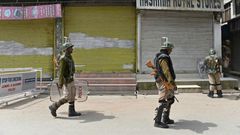 Indian paramilitary troopers patrol in Srinagar during a one-day strike called by Kashmiri separatists against Prime Minister Narendra Modi's visit