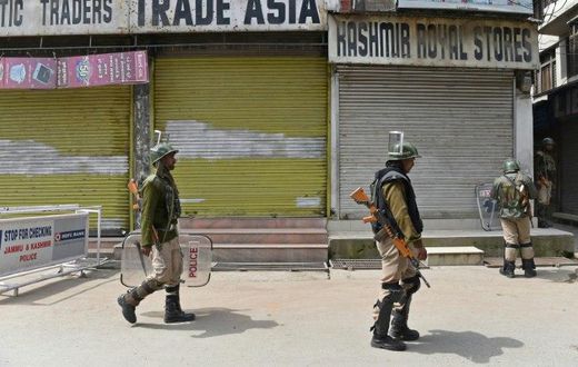 Indian paramilitary troopers patrol in Srinagar during a one-day strike called by Kashmiri separatists against Prime Minister Narendra Modi's visit