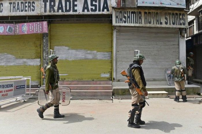 Indian paramilitary troopers patrol in Srinagar during a one-day strike called by Kashmiri separatists against Prime Minister Narendra Modi's visit