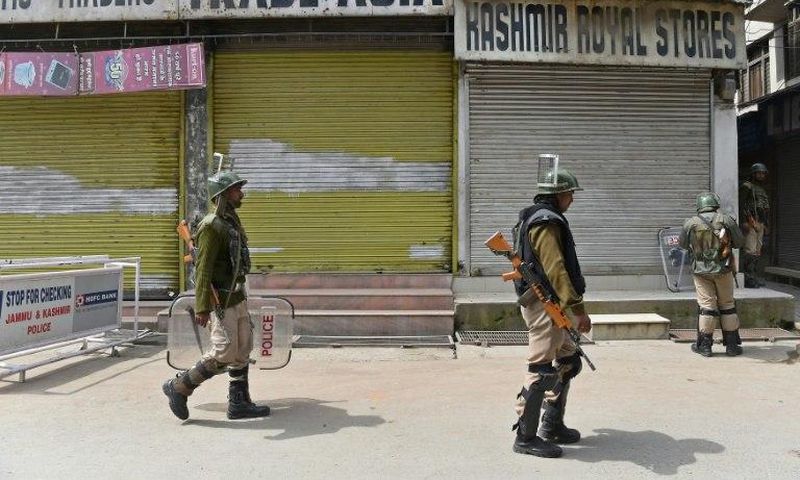 Indian paramilitary troopers patrol in Srinagar during a one-day strike called by Kashmiri separatists against Prime Minister Narendra Modi's visit