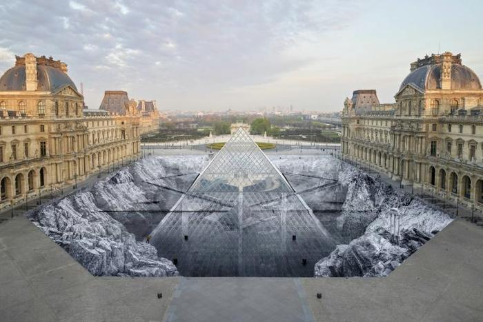 This huge collage by French artist JR in the courtyard of the Louvre lasted just a few hours before its 2,000-odd bits of paper were torn to shreds