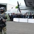 Mexican marines escort a group of alleged municipal policemen working for the Zeta cartel, five members of the same cartel and nine escaped inmates, in Veracruz, in 2011