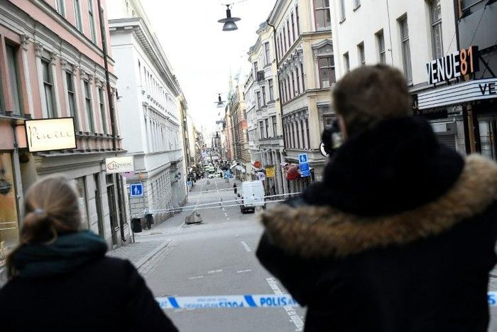 The scene where a truck crashed into the Ahlens department store is cordoned off at Drottninggatan in central Stockholm, April 7, 2017