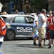 A police car patrols past Bayern supporters in the the Plaza del Sol before the Champions League quarter-final second leg at the Santiago Bernabeu stadium in Madrid on April 18, 2017