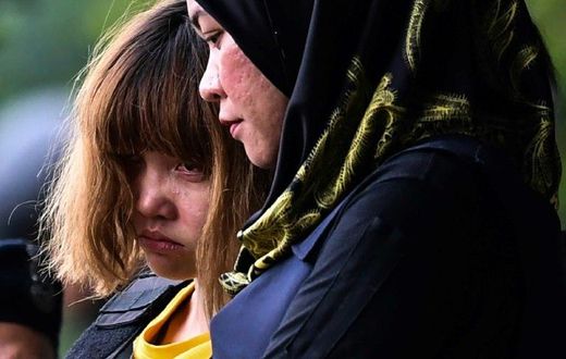 Vietnamese suspect Doan Thi Huong (left) wore body armour as she was escorted out of the Sepang courthouse on March 1, after being charged with the murder of Kim Jong-Nam