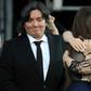 Argentina's then-President Cristina Kirchner (R) is embraced by her daughter Florencia next to her son Maximo, who went before a judge over their roles in the family's real estate company, during her inauguration ceremony in 2011
