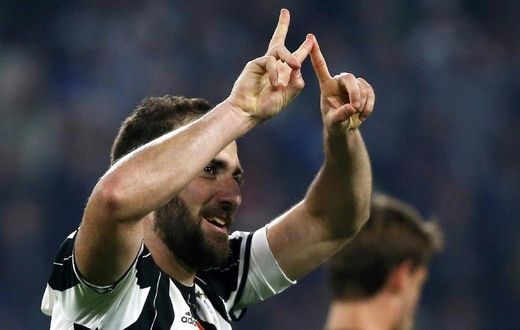 Juventus' forward Gonzalo Higuain from Argentina celebrates after scoring during the Italian Serie A football match Juventus vs Chievo on April 8, 2017 at the Juventus Stadium in Turin