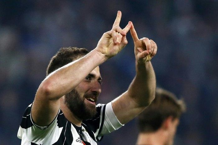 Juventus' forward Gonzalo Higuain from Argentina celebrates after scoring during the Italian Serie A football match Juventus vs Chievo on April 8, 2017 at the Juventus Stadium in Turin
