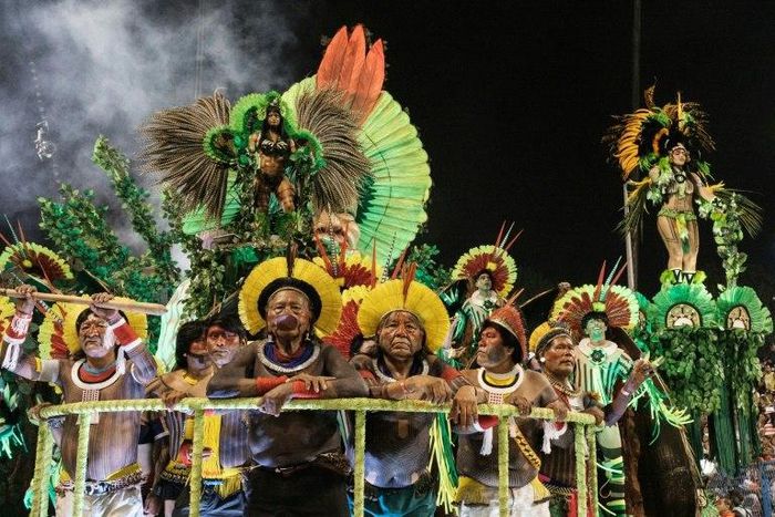 Indigenous leaders parade with the Imperatriz Leopoldinense samba school on the first night of Rio Carnival at the Sambadrome, early on February 27, 2017