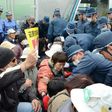 Japanese protesters demonstrate outside US Marine Camp Schwab on February 6, as they protest against the construction of a controversial new US airbase on Okinawa
