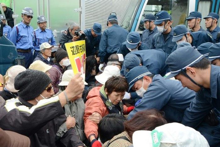 Japanese protesters demonstrate outside US Marine Camp Schwab on February 6, as they protest against the construction of a controversial new US airbase on Okinawa