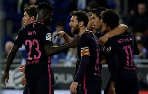 Barcelona's Luis Suarez (2ndR) celebrates with teammates after scoring his team's third goal during their Spanish league football match against Espanyol on April 29, 2017