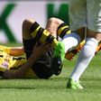Dortmund's midfielder Julian Weigl lies injured on the pitch during the German first division Bundesliga football match against FC Augsburg on May 13, 2017