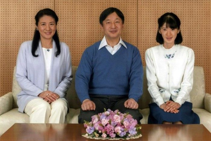 Crown Prince Naruhito (C) poses with Crown Princess Masako (L) and their daughter Princess Aiko at Togu Palace in Tokyo in a photo released on February 22, 2017 by the Imperial Household Agency of Japan