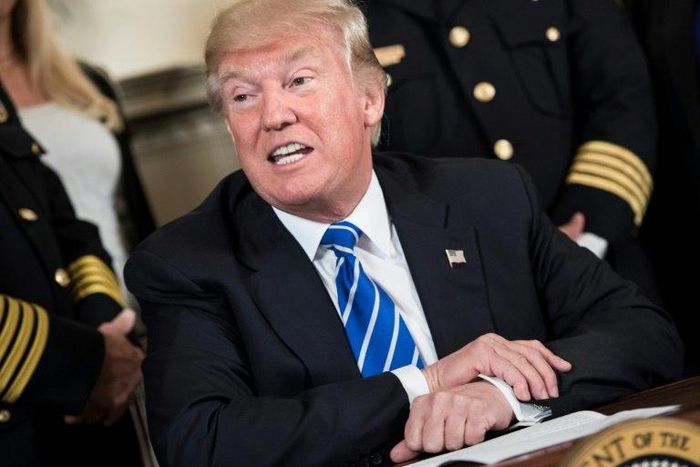 President Donald Trump ignored a question about whether climate change is real during an event with law enforcement officers