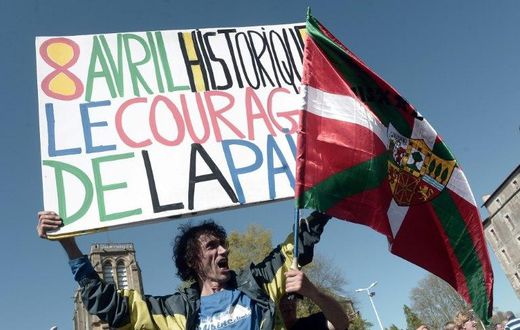 Jean-Baptiste Redde or " Voltuan", a well-known protester in France for his placards, holds a sign reading: "Historic April 8, the courage of peace" at a rally in Bayonne