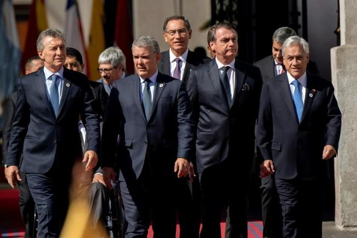 Argentine President Mauricio Macri, Colombia's Ivan Duque, Martin Vizcarra of Peru, Brazil's Jair Bolsonaro, Paraguay's Mario Abdo host President Sebastian Pinera of Chile, pictured at La Moneda palace in Santiago at the launch of the new PROSUR bloc