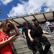 Armed police patrol at Wembley Park Tube Station in London on May 27, 2017 ahead of the English FA Cup final football match between Arsenal and Chelsea