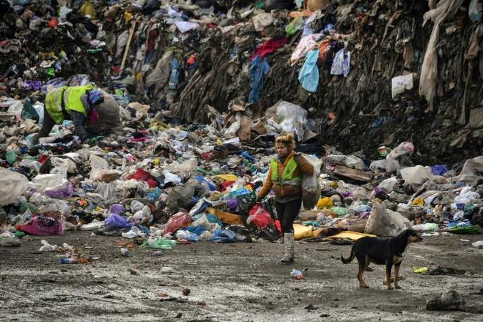 Whole families subsist from the income they make from recyclable waste that they pick from the rubbish heap
