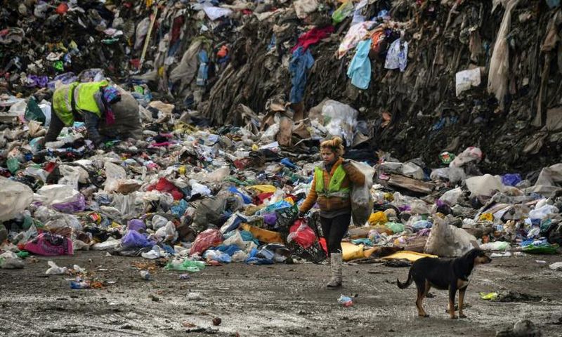 Whole families subsist from the income they make from recyclable waste that they pick from the rubbish heap