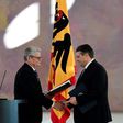 German President Joachim Gauck (left) hands Sigmar Gabriel the Foreign Ministty portfolio during a ceremony at the Bellevue Palace in Berlin, on January 27, 2017