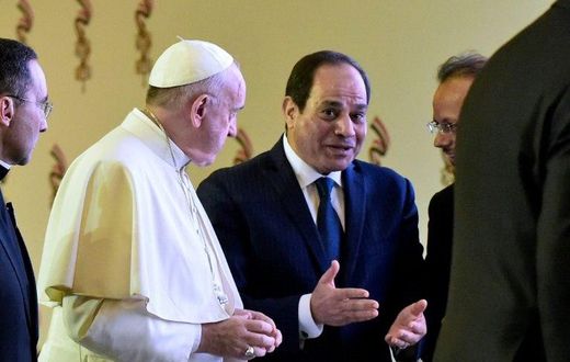 Pope Francis and Egyptian President Abdel Fattah al-Sisi chat with officials after meeting in Cairo on April 28, 2017