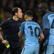Manchester City midfielder Yaya Toure (R) and striker Sergio Aguero (C) remonstrate with the referee after Aguero was shown a yellow during the Champions League Round of 16 first-leg in Manchester, north west England on February 21, 2017