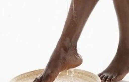 An African woman cleaning her feet