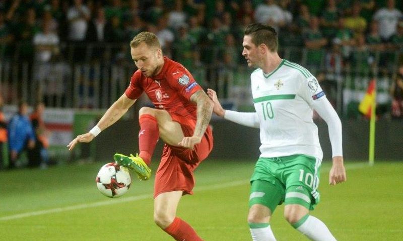 Michal Kadlec of Czech Republic (L) fights for the ball with Kyle Lafferty of Northern Ireland during their 2018 World Cup qualification match, in Prague, on September 4, 2015