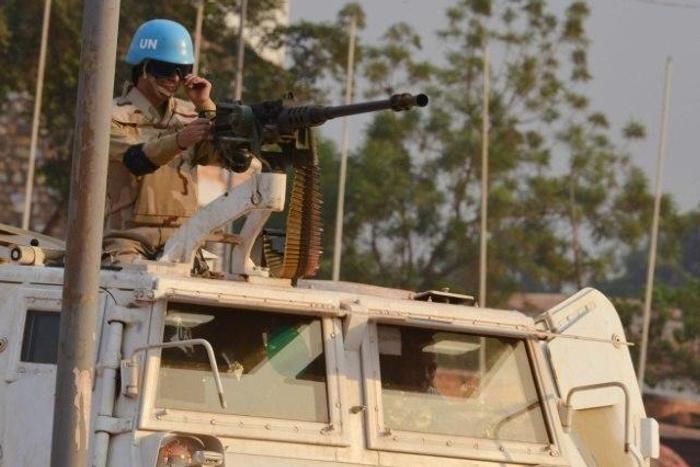 A Moroccan peacekeeper from the United Nations Mission in the Central African Republic (MINUSCA) patrols in Bangui