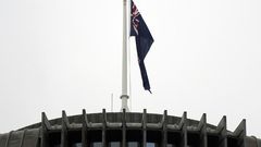 The New Zealand flag hangs at half mast outside the parliament building in Wellington on Tuesday following last week's mosque massacre
